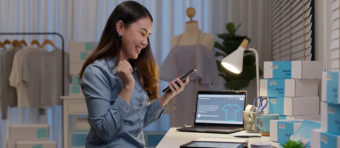 women looking on mobile with a happy face