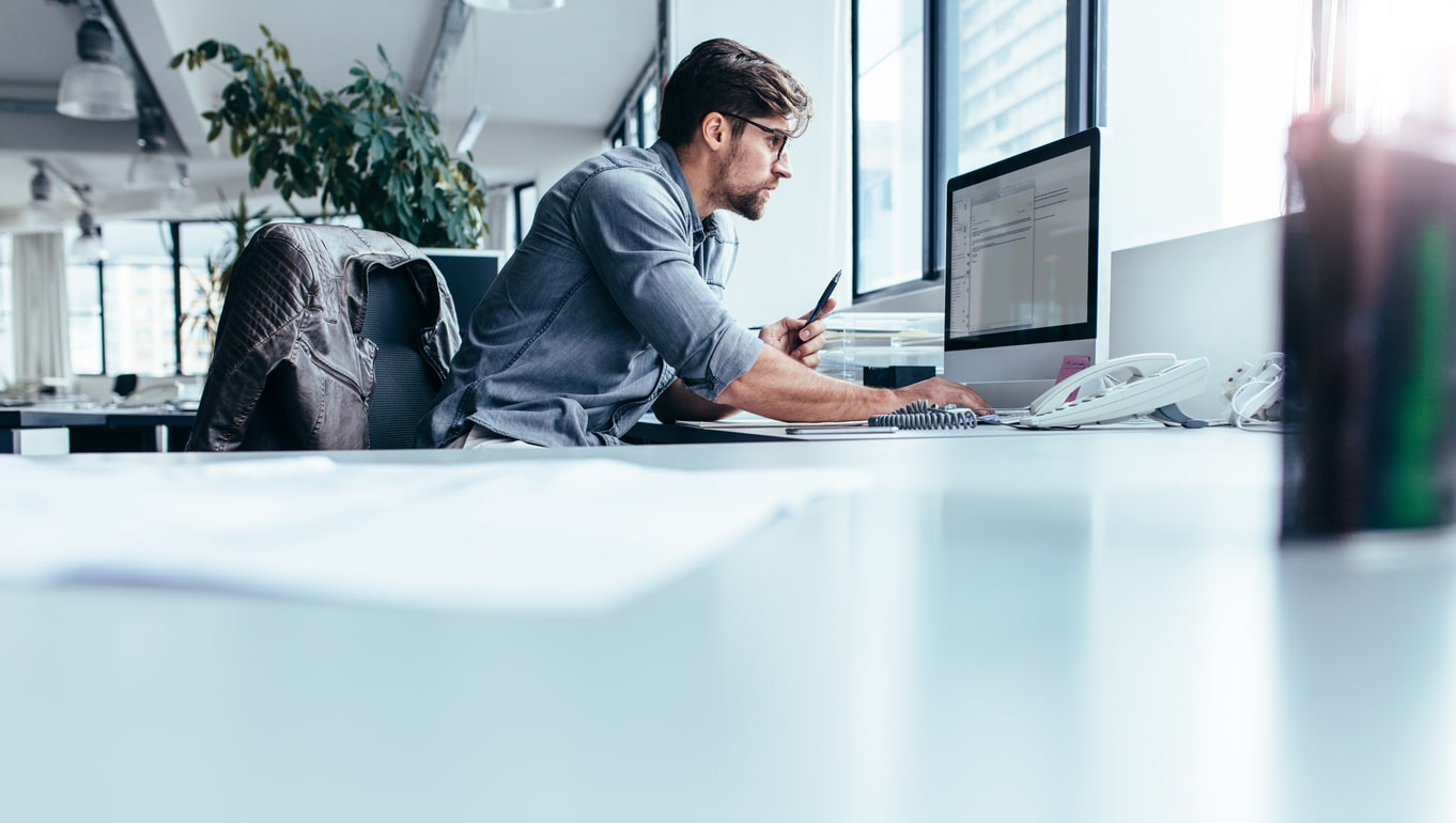 man-working-on-laptop-in-office